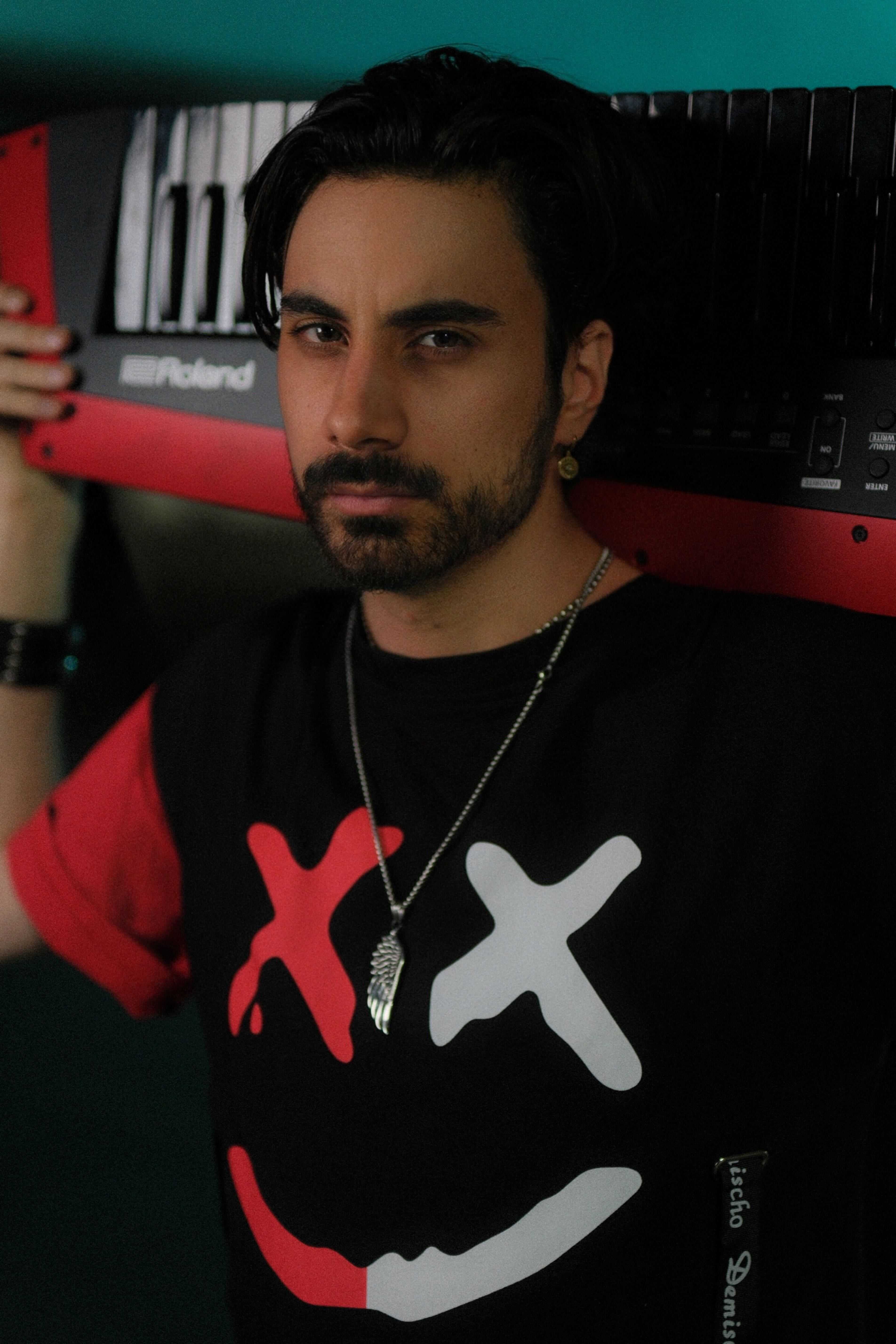 Daniel Michael face with keytar on back "Need You" photoset